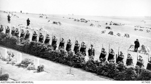 French soldiers salute the Memorial, surrounded by gardens and hay fields (AWM H17495)